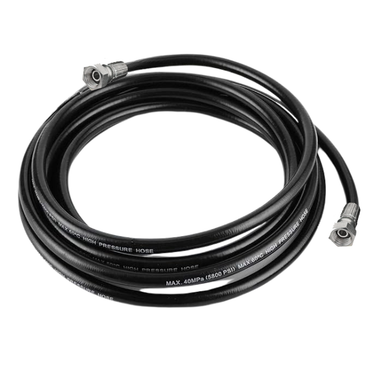 Coiled high-pressure hose with metal connectors on a white background